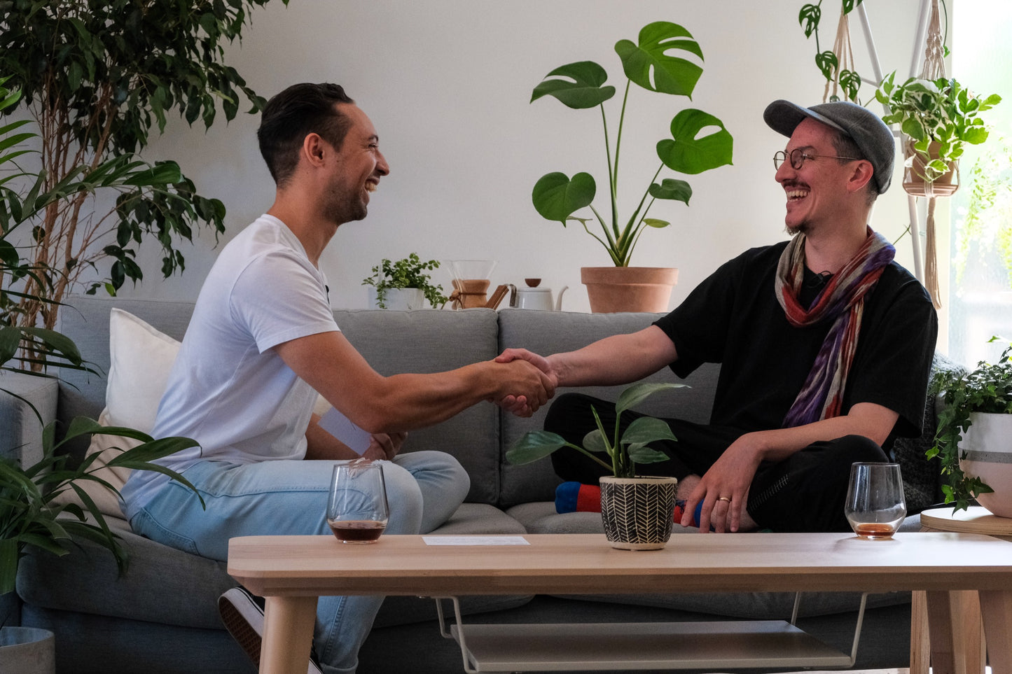 Charlie and Vaughan shake hands after a chat about coffee